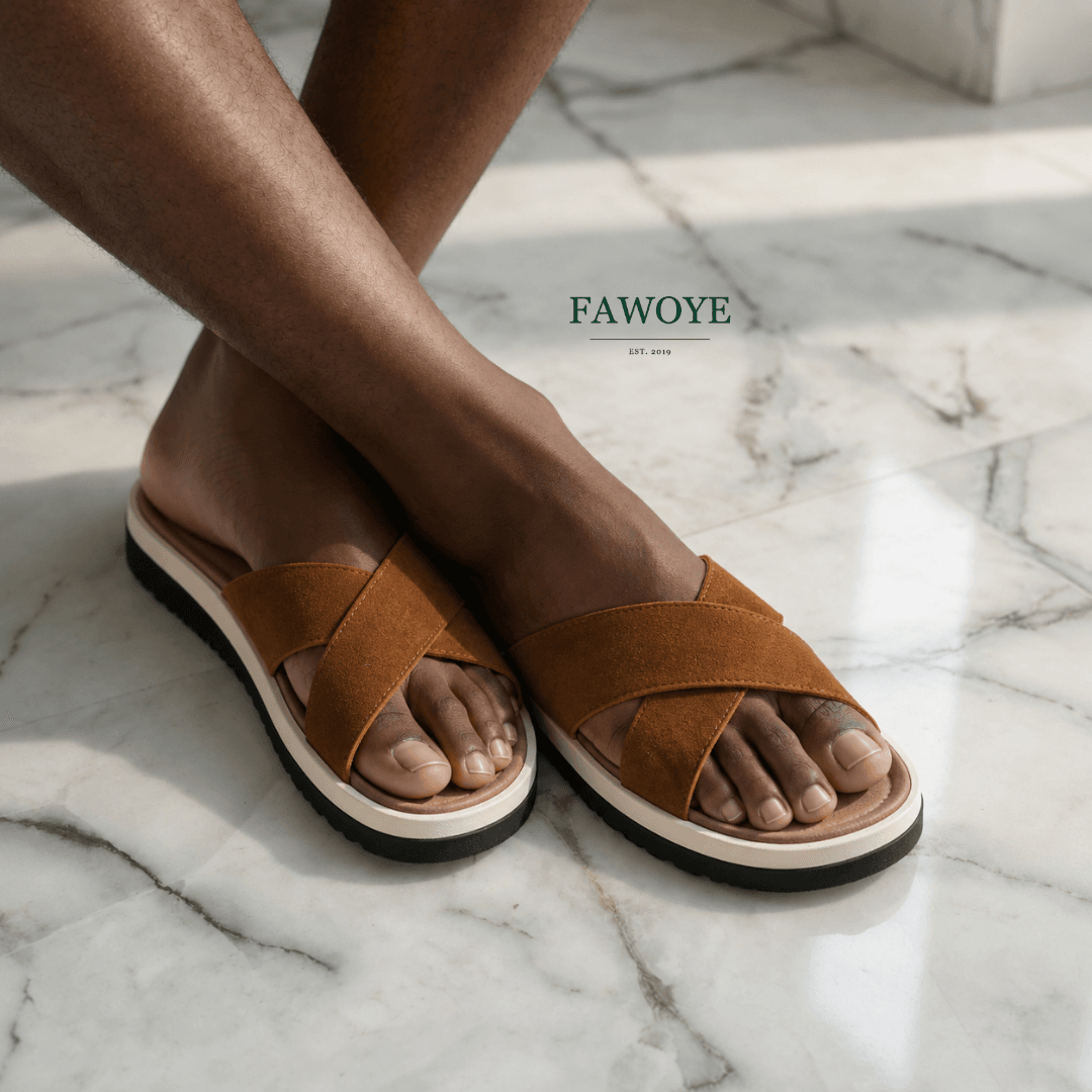 Wearing FAWOYE tan leather slides styled casually, handmade in Nigeria - FAWOYE handmade shoes Nigeria