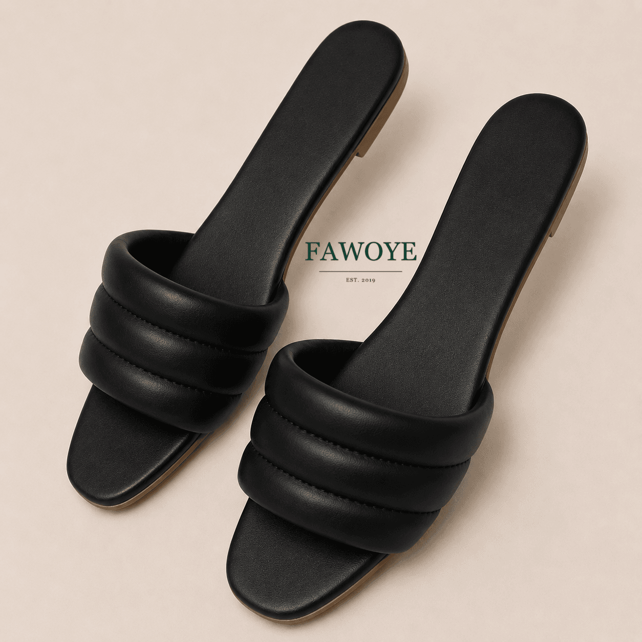 Black padded-strap slide for a comfortable women’s outfit.