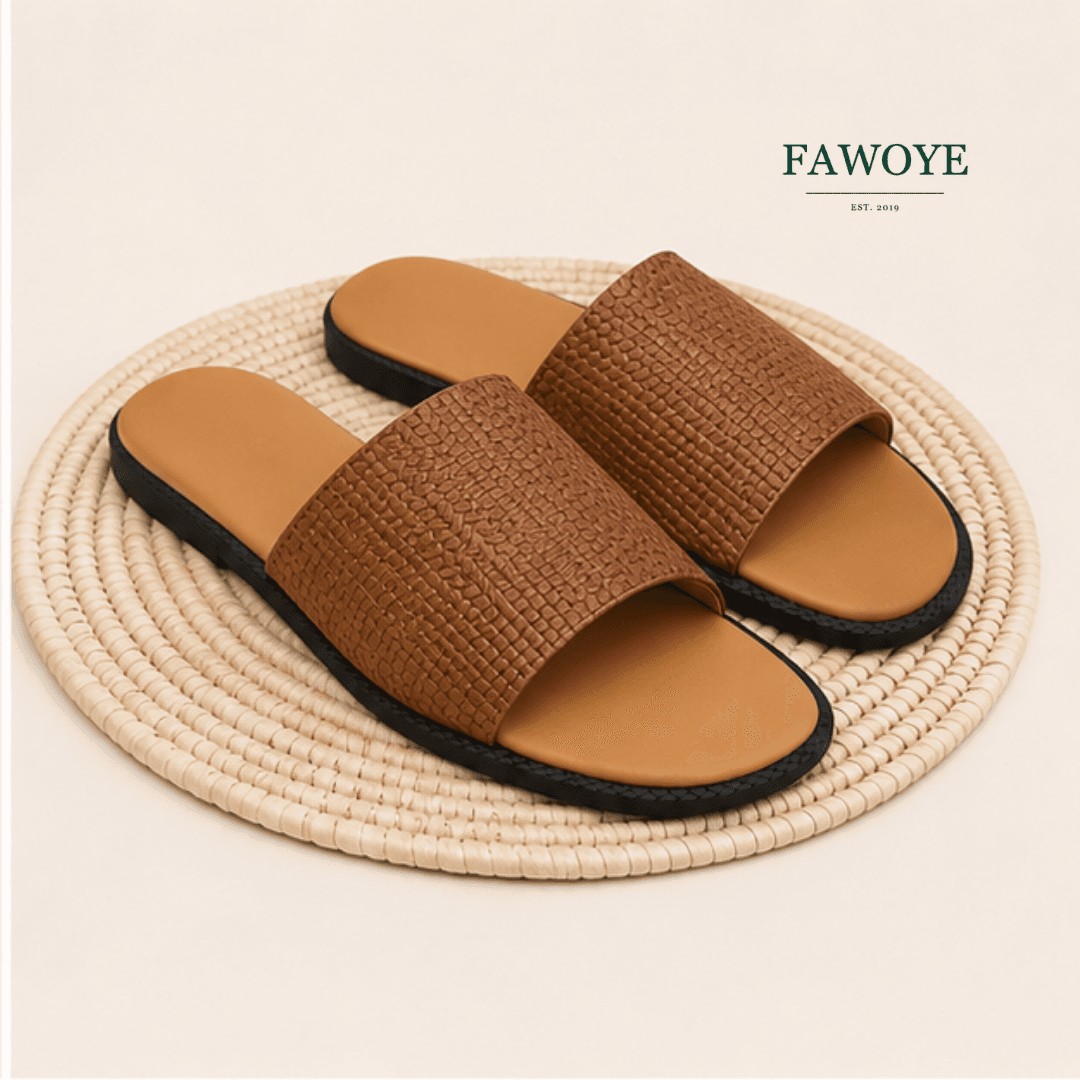 Brown women’s slide with a woven leather upper