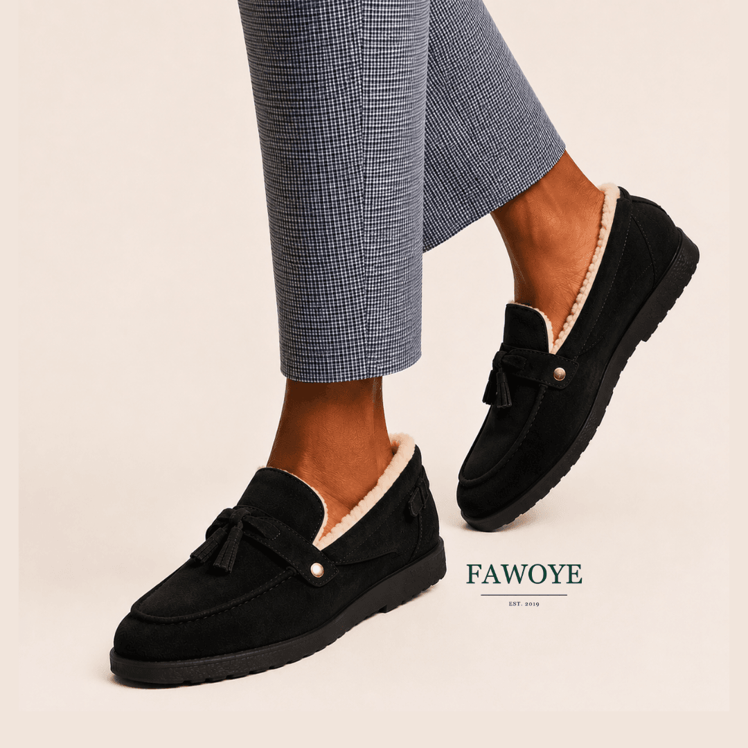 Black suede tassel loafer with a clean restored surface