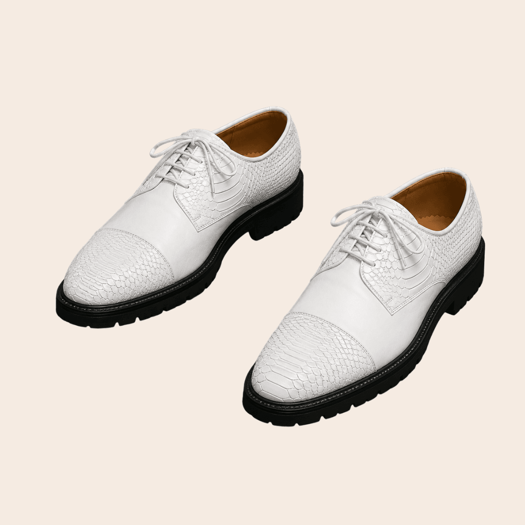 White cap-toe Oxford shoes for a statement formal look.