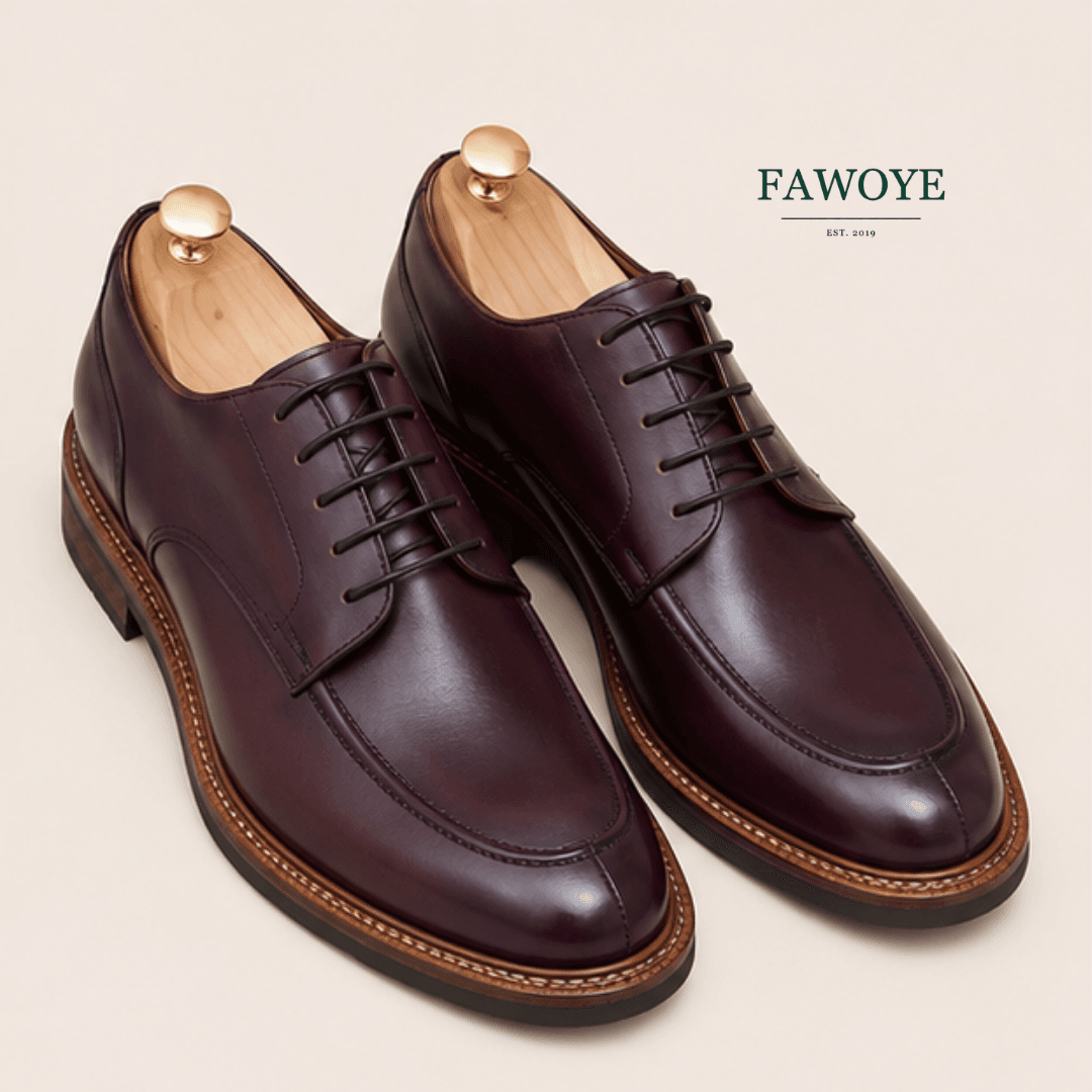 Wine leather Oxford shoes suited to navy and grey tailoring.